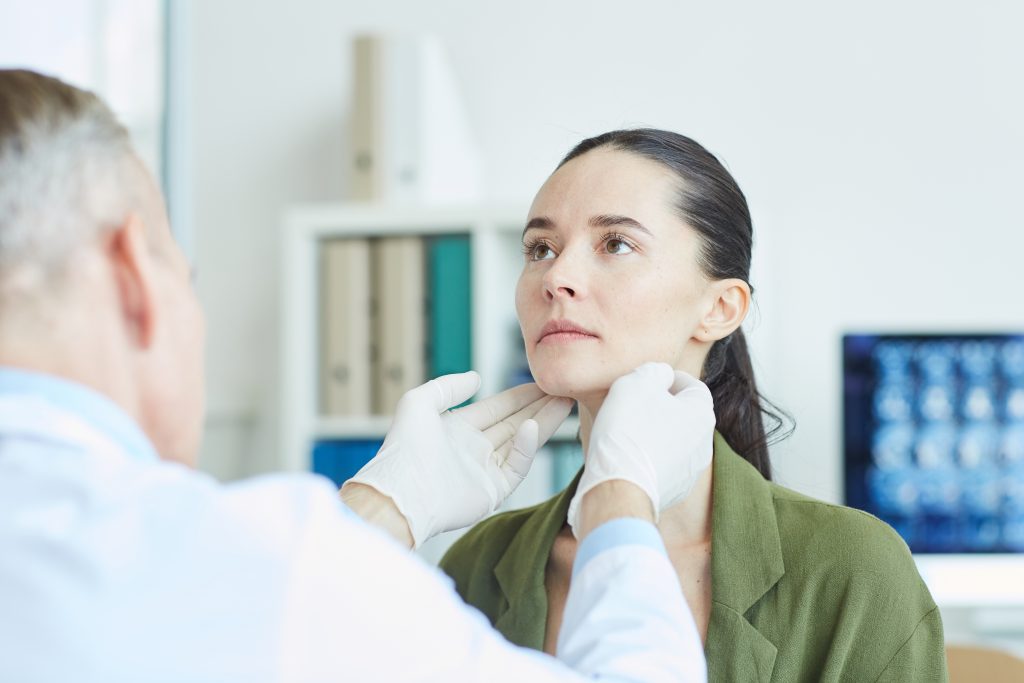 medical exam of woman in clinic setting