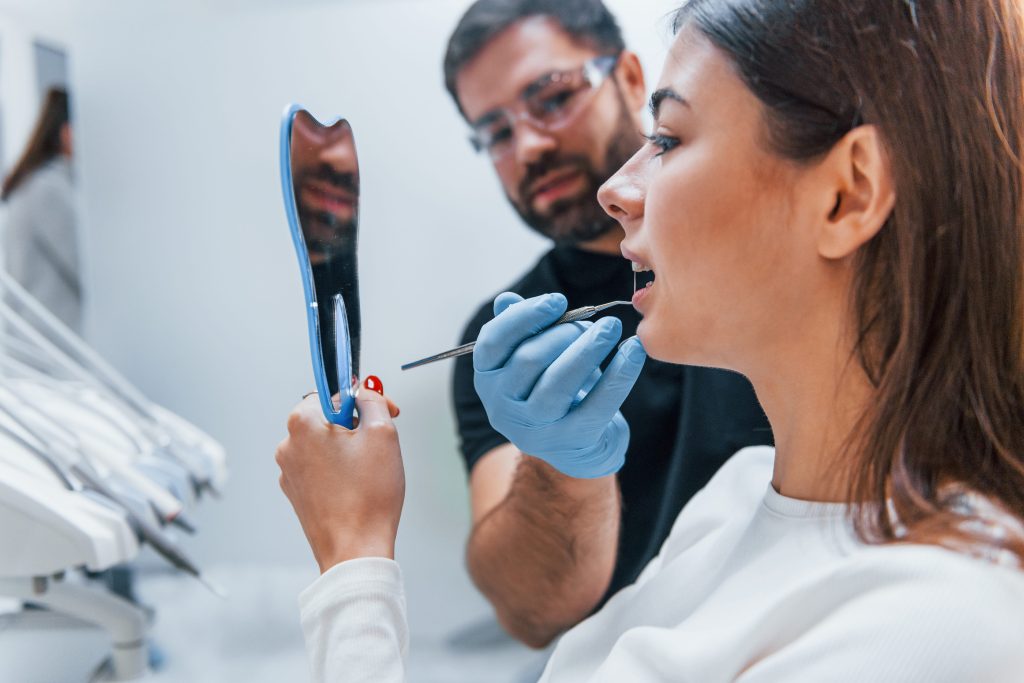 woman receiving dental care at dentist office